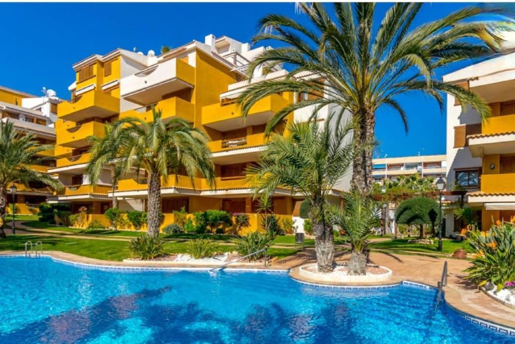 Apartment Espana - Punta Prima Orihuela Costa - Large For 6-people 85m2 And Terrace 40m2 Air Conditioning Wi-fi Living Kitchen 2 Bedrooms 2 Bathrooms 3 Swimming Pools Parking Security To The Sea 160m Only 40 Min To The Airport