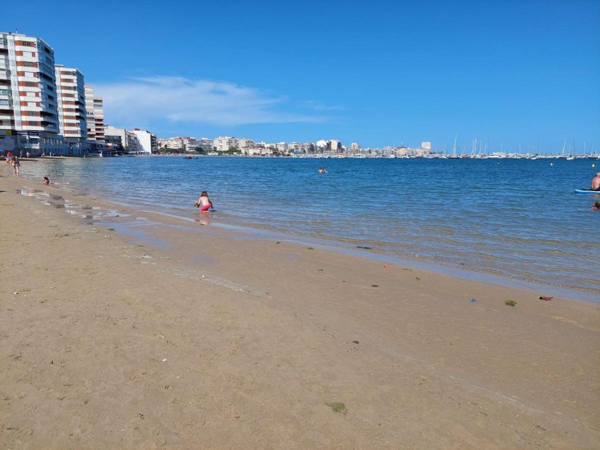 Apartment Espana - Punta Prima Orihuela Costa - Large For 6-people 85m2 And Terrace 40m2 Air Conditioning Wi-fi Living Kitchen 2 Bedrooms 2 Bathrooms 3 Swimming Pools Parking Security To The Sea 160m Only 40 Min To The Airport *